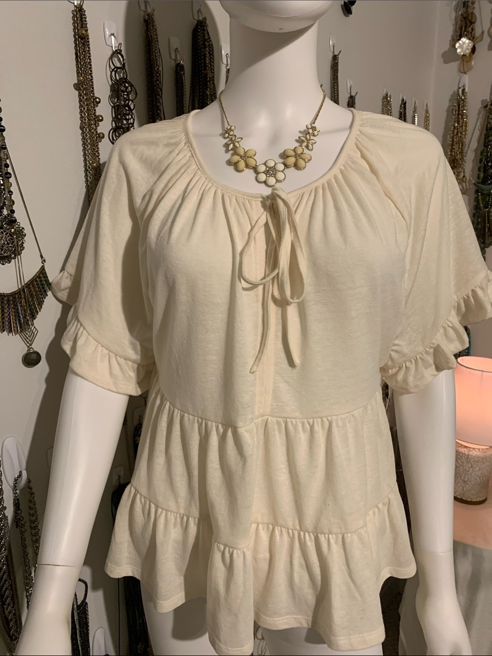 HYFVE Cream Ruffle Tie-Front Peplum Tunic with necklace